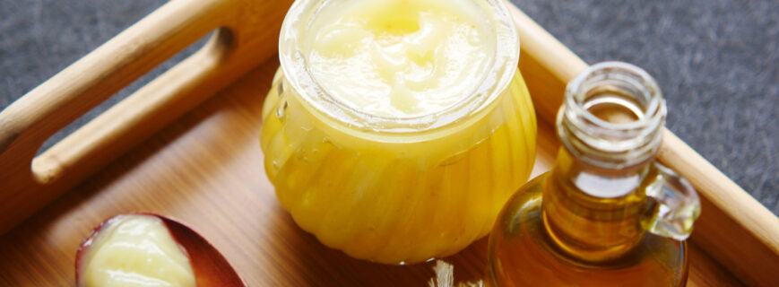 homemade ghee in container on a table , homemade ghee in container on a table